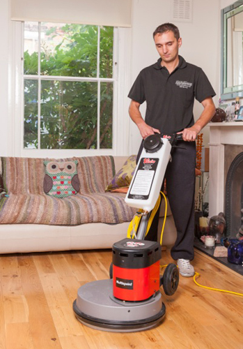 Cleaner polishing wood floor for Floor Cleaning London